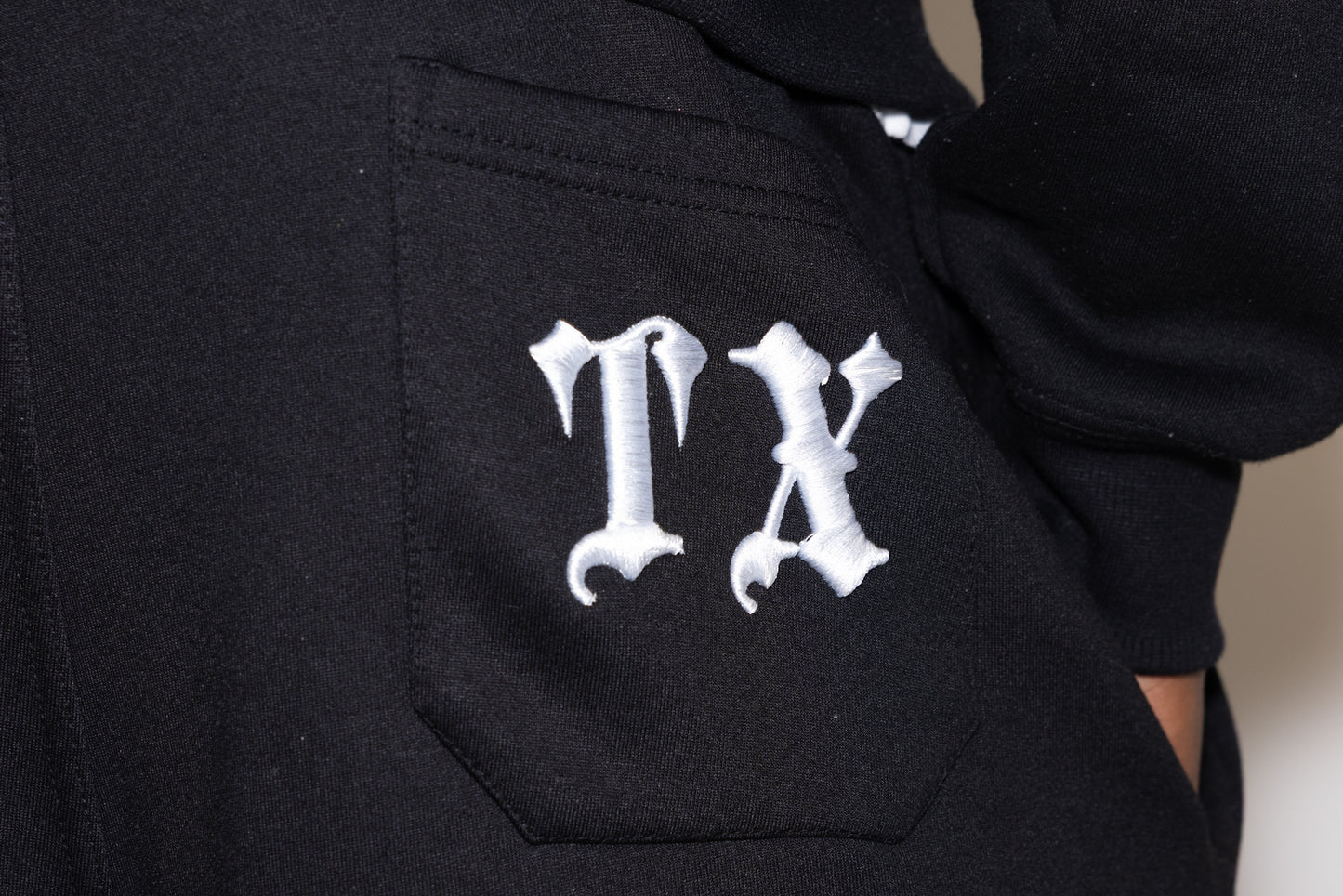 Black straight leg pants 'TX' logo on back pocket